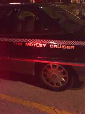 photograph of car with Motley Cruiser written on side 