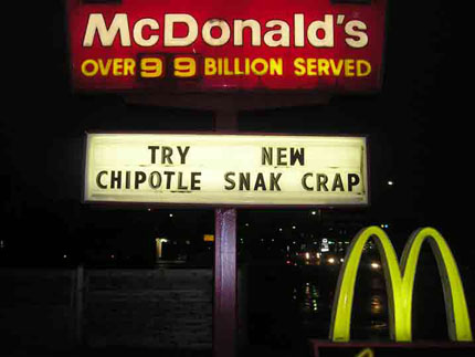 photograph of McDonald's sign that reads Try New Chipotle Snack Crap 